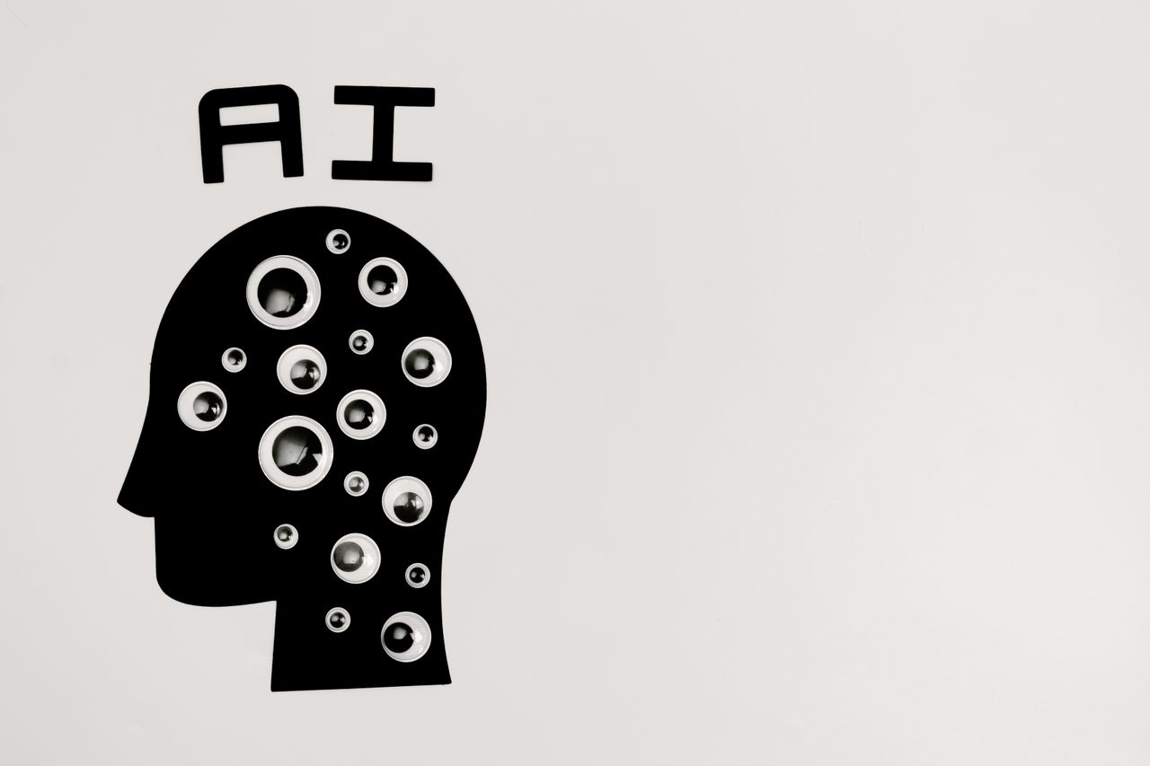 The Art of Drawing Readers In: Your attractive post title goes here Abstract illustration of AI with silhouette head full of eyes, symbolizing observation and technology.